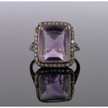 An 18ct gold amethyst and diamond set ring, setting height 16mm, size N.