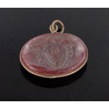 A 19th century Cameo carved Cornelian pendant, unmarked setting, length 26mm.