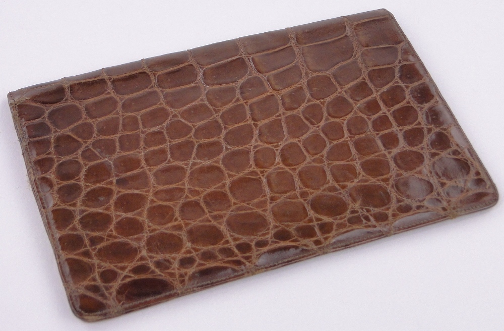 An Asprey crocodile skin wallet, length 17cm.