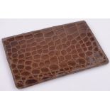 An Asprey crocodile skin wallet, length 17cm.