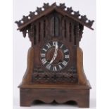An unusual German carved wood cased clock with musical automaton military bugler figure,