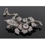 A diamond set floral spray brooch, largest stone approx. 0.