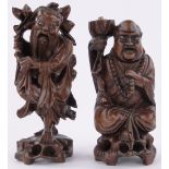 2 Oriental carved and stained wood figures, largest height 34cm, (2).