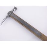 A steel mounted ice pick, with half leather covered wooden handle, length 64cm.