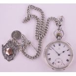 An Omega silver cased topwind open face pocket watch, case width 48mm on silver chain with fobs.