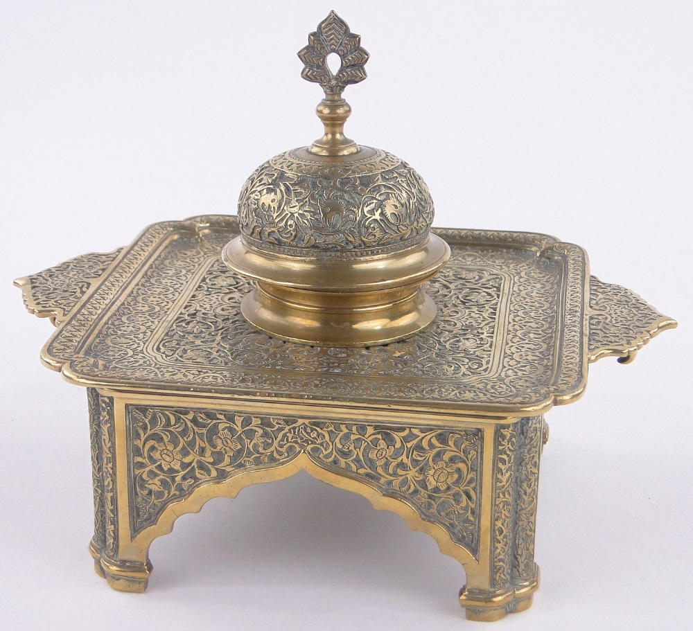 An ornate Middle Eastern brass ink stand,