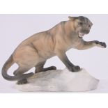 A Beswick pottery panther on a rock, length 12", height 8".