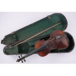 An early 20th century violin, bearing copy Guarnerius label, body length 35.5cm, wooden case.