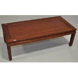 An Oriental hardwood rectangular coffee table, length 4'2", height 1'4", depth 2'.
