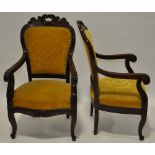 A pair of Regency mahogany open arm chairs,