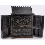 A 19th century Indian ebony and ivory inlaid cabinet of small size,