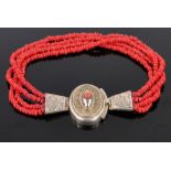 A 19th century 4 strand coral bead bracelet, with unmarked silver gilt filigree clasp,