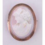 A 19th century carved coral Cameo, portrait of a lady in 9ct gold frame, height 42mm.