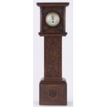 A 19th century carved wood miniature long case clock, with floral enamel dial, case dated 1892,