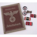 A group of German Third Reich militaria, including an Arbeitsbuch, 2 enamelled badges, etc.