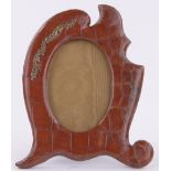 An Edwardian crocodile skin photo frame, with gilt metal mount, height 23cm.