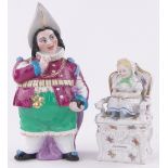 2 19th century porcelain tobacco boxes, 1 in the form of a girl in an armchair,