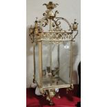 A large brass framed 4 glass lantern light fitting, height 95cm.