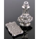 A continental silver vesta case, height 7cm and a silver pepperette, (2).