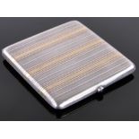 A continental silver and gold inlaid cigarette case, with sapphire thumb piece, indistinct marks,