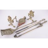 A 3-piece brass fire companion set, with Prince of Wales feathers, fire dogs and brass bellows.