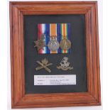 A First War 1914/15 Trio group, to Pte. Luther Berry MGC, framed with cap badges.
