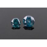 2 Unmounted brilliant-cut blue diamonds, approx. 1.5cts total.