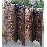 A large Chinese hardwood 4-fold screen, relief carved with 60 dragons and text characters,