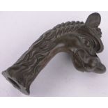 A heavy Oriental bronze ornamental dragon head, height 17cm.
