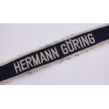 A German Third Reich Hermann Goring embroidered wrist band.