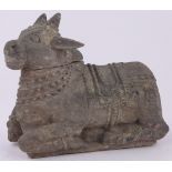 A large Indian carved wood ornamental bull, length 45cm, height 40cm.