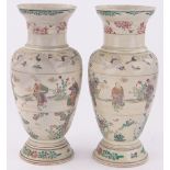 Pair of Oriental Satsuma porcelain vases, decorated with figures and cranes, height 40cm.