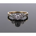 An 18ct gold and platinum solitaire diamond ring, size M.