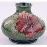 A Moorcroft Hibiscus pattern bulbous vase, height 10cm.