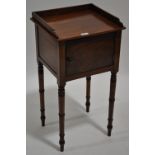 A George IV mahogany pot cupboard with single door, turned legs, width 1'4", height 2'5",