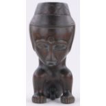 An African carved and stained hardwood fertility cup, height 29cm.