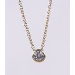 A 0.3ct solitaire diamond pendant, 18ct gold setting and chain.