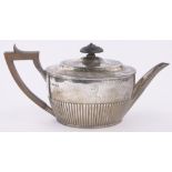A Victorian silver teapot of half fluted oval form, London 1880, 12.5 oz.