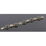 A Chinese jade and silver gilt bracelet.