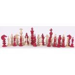 A 19th century red and white stained ivory part chess set, King height 8.5cm (29 pieces).