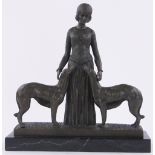 A reproduction Art Deco style bronze figure, woman with 2 dogs, black marble plinth,