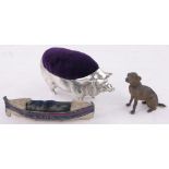 A miniature cold painted white metal seated dog, height 4.