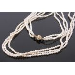 A triple strand freshwater pearl necklace, with 9ct gold clasp.