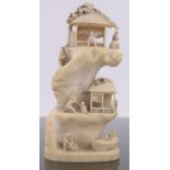 A 19th century Chinese ivory ornamental fishing village, with figures and boat,