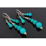 Pair of Victorian triple strand turquoise bead mounted drop earrings, unmarked gold settings,