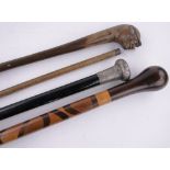 4 Various 19th century walking sticks, including a silver topped cane and a measuring stick, (4).