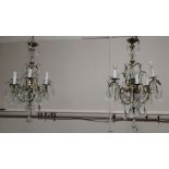 Pair of brass and crystal chandeliers circa 1920s with cut-glass lustre drops, height 77cm,