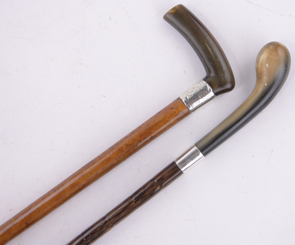 2 Horn and silver handled walking sticks.