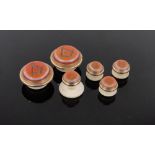 A cased set of 19th century agate and ivory Masonic studs by Thomas Lund.