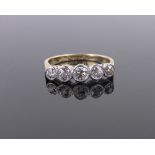 An 18ct gold and platinum 5 stone diamond ring, size L.